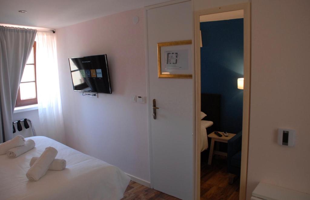 Postel nebo postele na pokoji v ubytování Old Town Inn