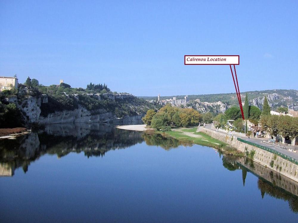 a river with a sign that reads current harbor at Cairenou Location in Saint-Martin-dʼArdèche