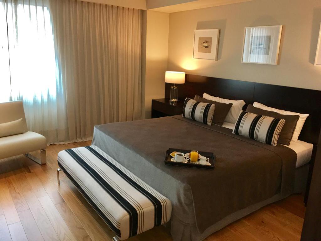 Cama ou camas em um quarto em Hotel Metropolitano Supara