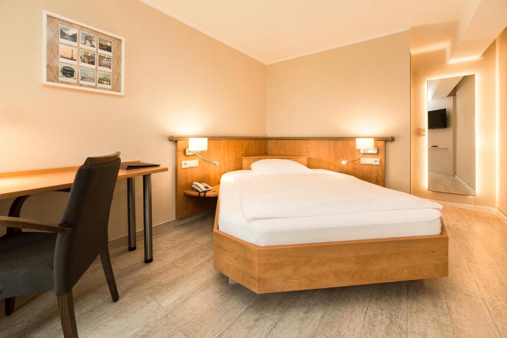 Postel nebo postele na pokoji v ubytování Hotel Spree-idyll