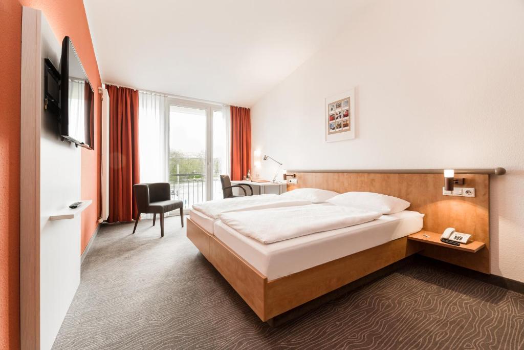 Postel nebo postele na pokoji v ubytování Hotel Spree-idyll
