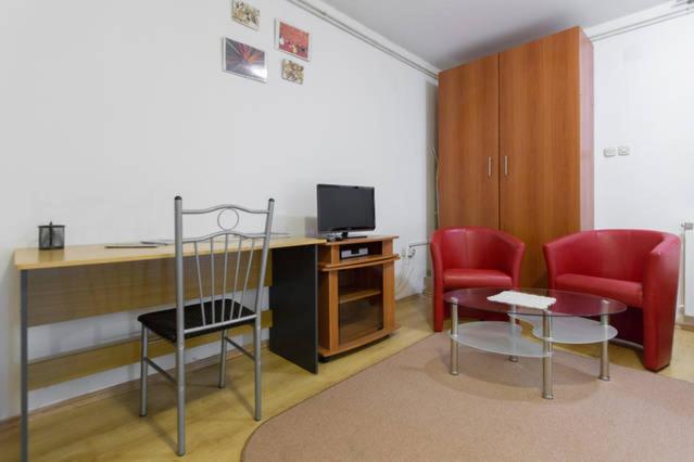 Televízia a/alebo spoločenská miestnosť v ubytovaní Apartments Maximir