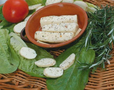 a plate of food with a bowl of cheese and vegetables at Albergo Maria Cristina in Esperia