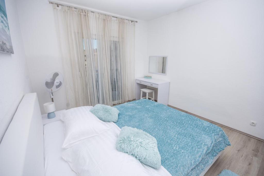 Posteľ alebo postele v izbe v ubytovaní Aparment Jomarko