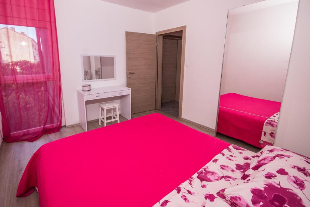 Posteľ alebo postele v izbe v ubytovaní Aparment Jomarko