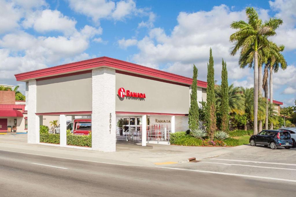 a mobil gas station with a car parked in front at Ramada by Wyndham Miami Springs/Miami International Airport in Miami