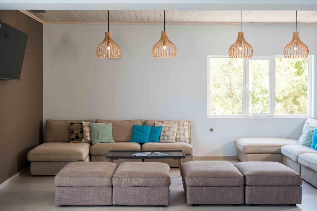 a living room with a couch and a table at Balos Beach in Kissamos
