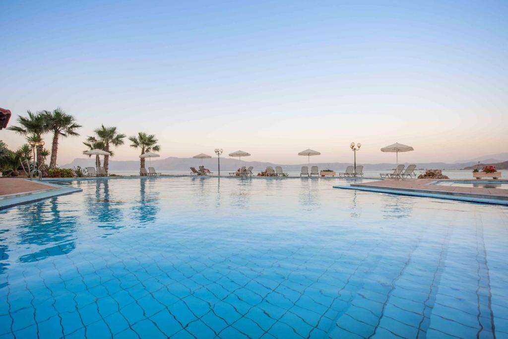 a large swimming pool with a view of the ocean at Balos Beach in Kissamos