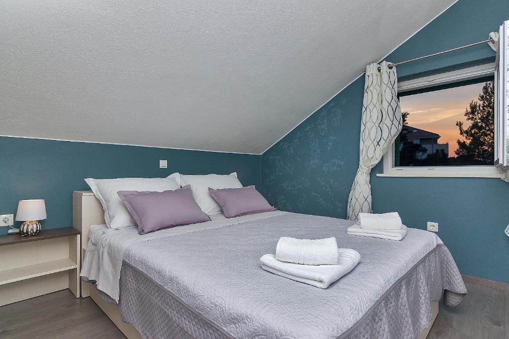Postel nebo postele na pokoji v ubytování Apartments Beso