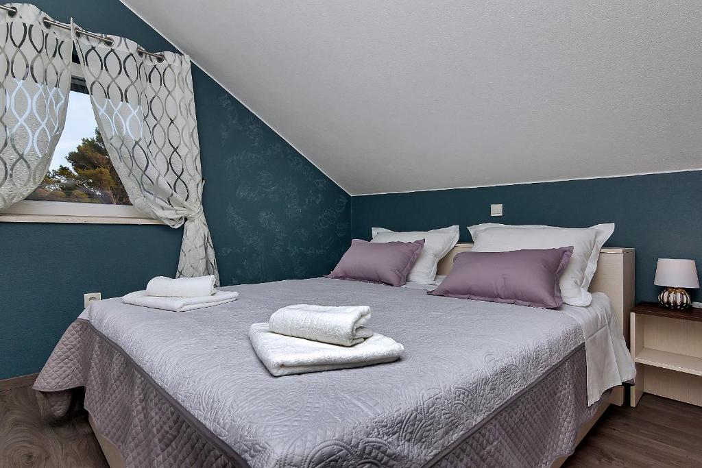 Postel nebo postele na pokoji v ubytování Apartments Beso