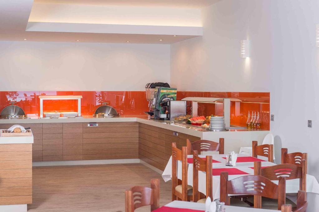 a kitchen with a table and chairs in a kitchen at Balos Beach in Kissamos