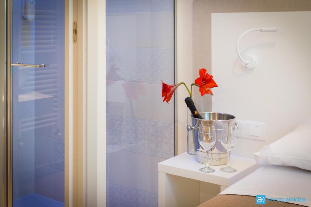 Postel nebo postele na pokoji v ubytování Hotel Amicizia