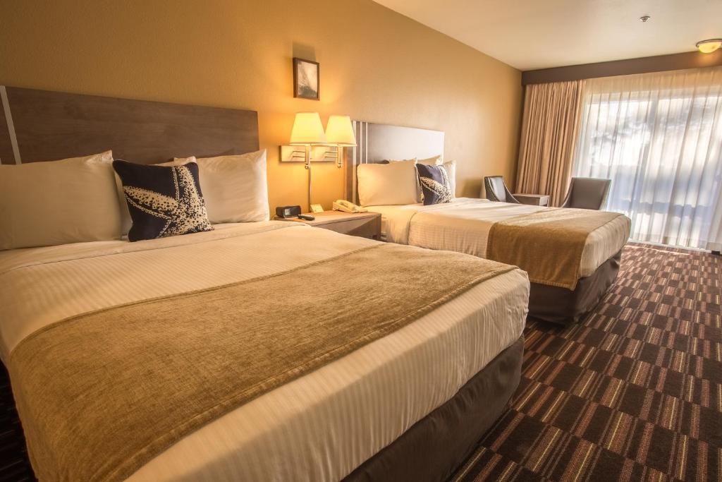 Postel nebo postele na pokoji v ubytování Inn at Wecoma