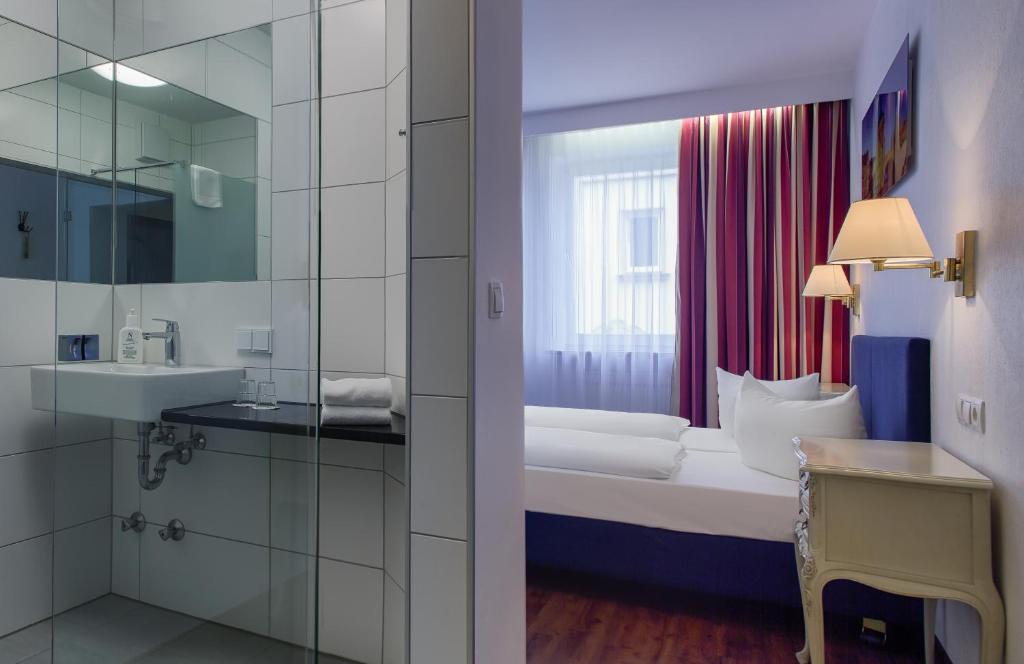 Postel nebo postele na pokoji v ubytování Hotel National