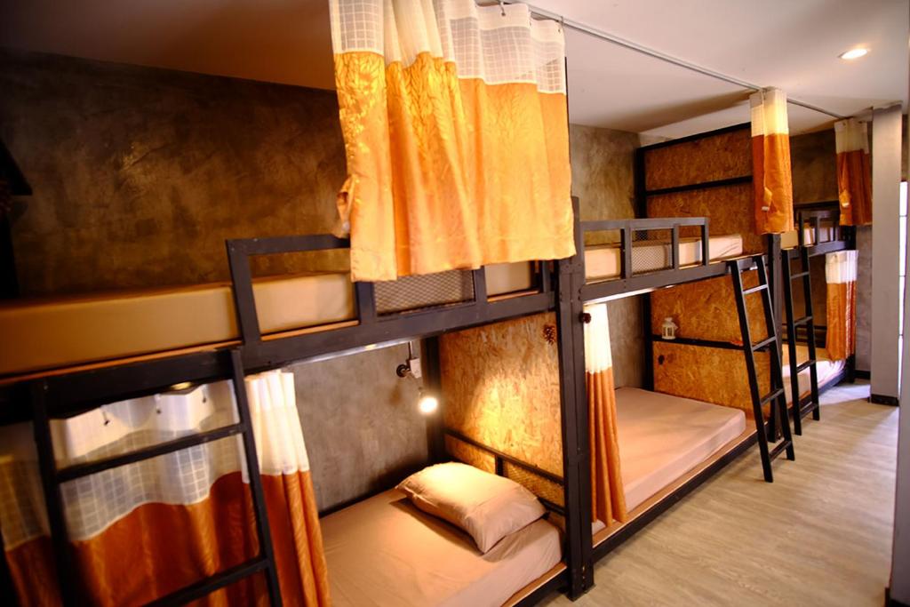 a group of bunk beds in a room at Nap Corner hostel in Phitsanulok
