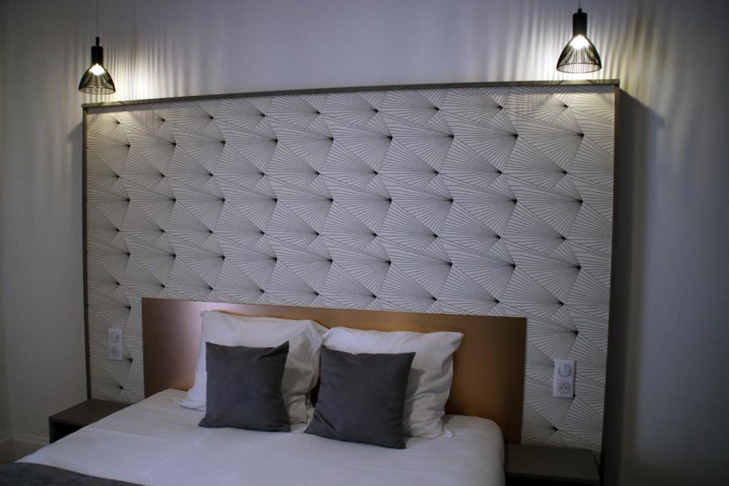 Postel nebo postele na pokoji v ubytování Hotel Saint Vincent