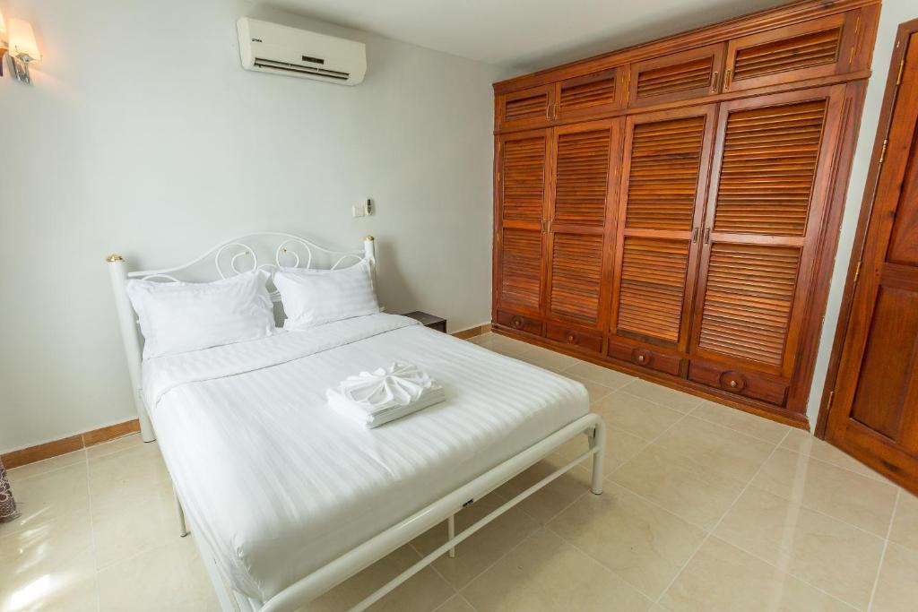 Postel nebo postele na pokoji v ubytování MekongView 1 CondoTel