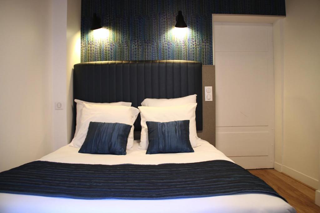 Postel nebo postele na pokoji v ubytování Hotel Saint Vincent