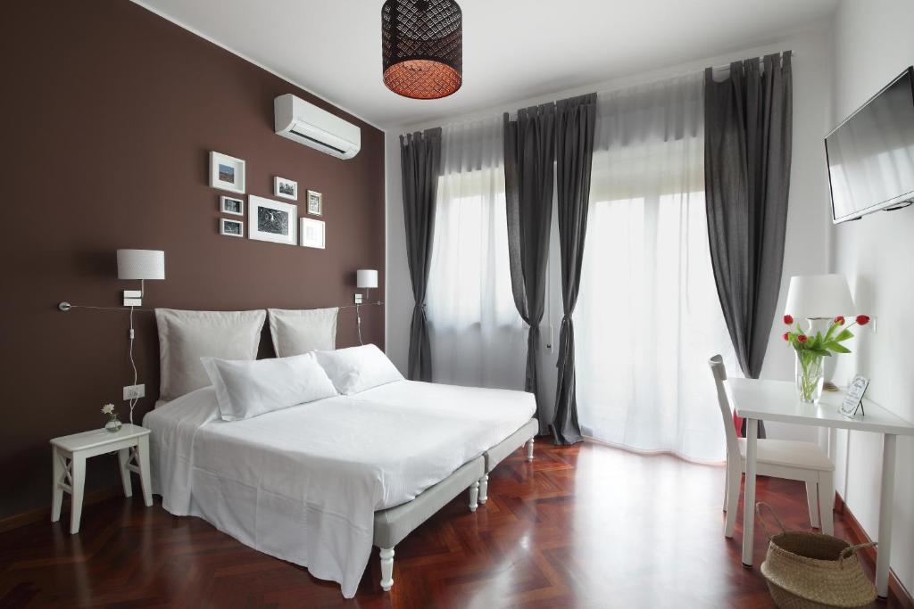 Postel nebo postele na pokoji v ubytování Laurus Sicilian Holiday