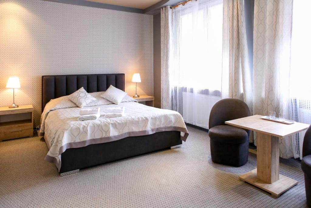 Un pat sau paturi într-o cameră la Sosnowe Zacisze