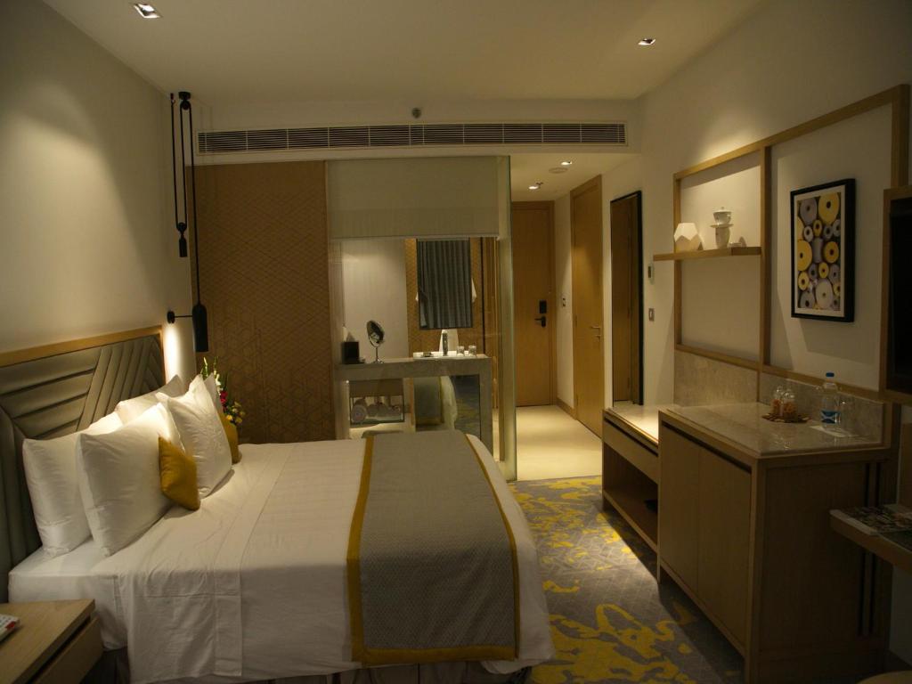 Postel nebo postele na pokoji v ubytování Welcomhotel by ITC Hotels, RaceCourse, Coimbatore