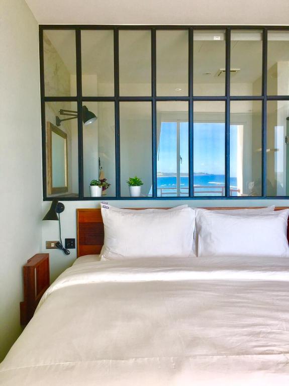 Rúm í herbergi á il Piccolo Polpo Hotel