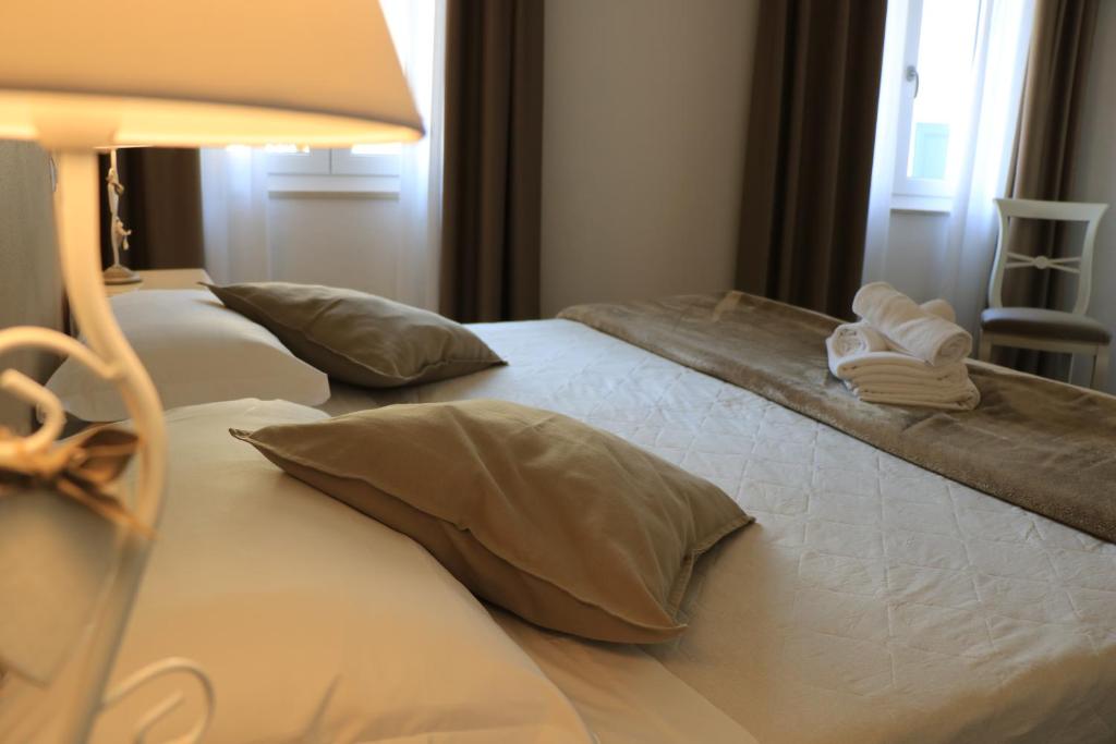 Postel nebo postele na pokoji v ubytování Hotel RivaMia