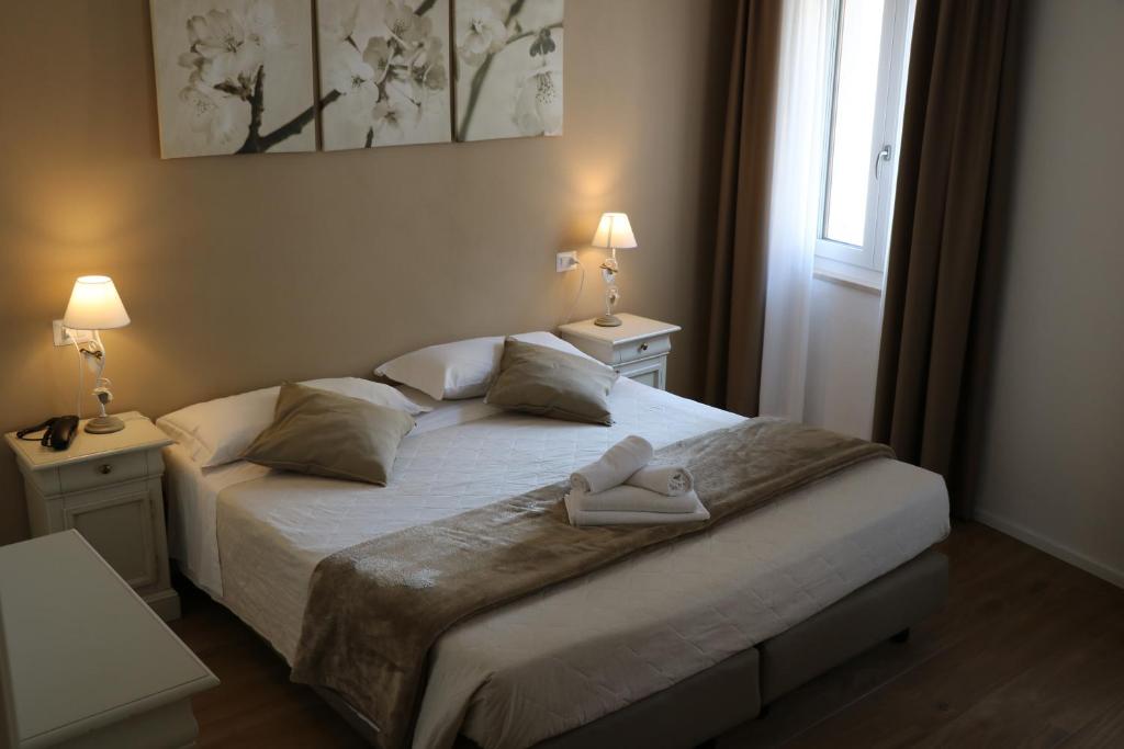 Postel nebo postele na pokoji v ubytování Hotel RivaMia
