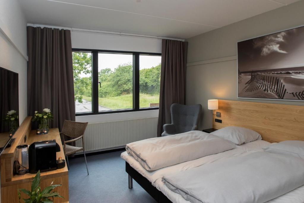 Postel nebo postele na pokoji v ubytování Hotel 6400