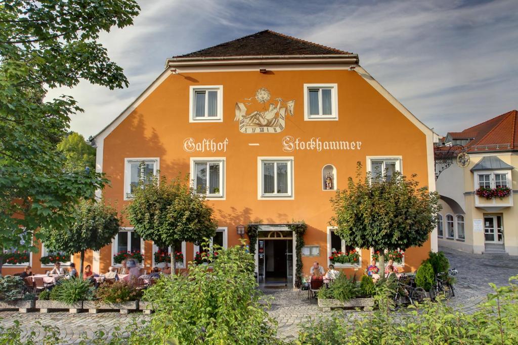 a large orange building with the words scottish supermarket at Gasthof Stockhammer in Kelheim