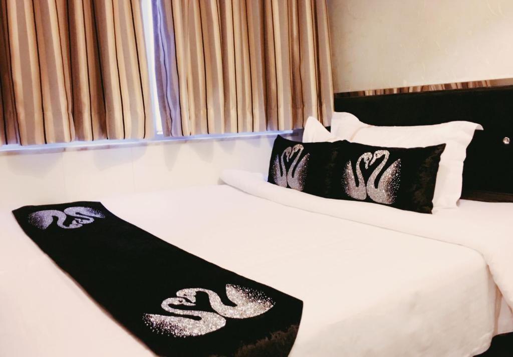 Voodi või voodid majutusasutuse Seasons Hotel - Causeway Bay toas