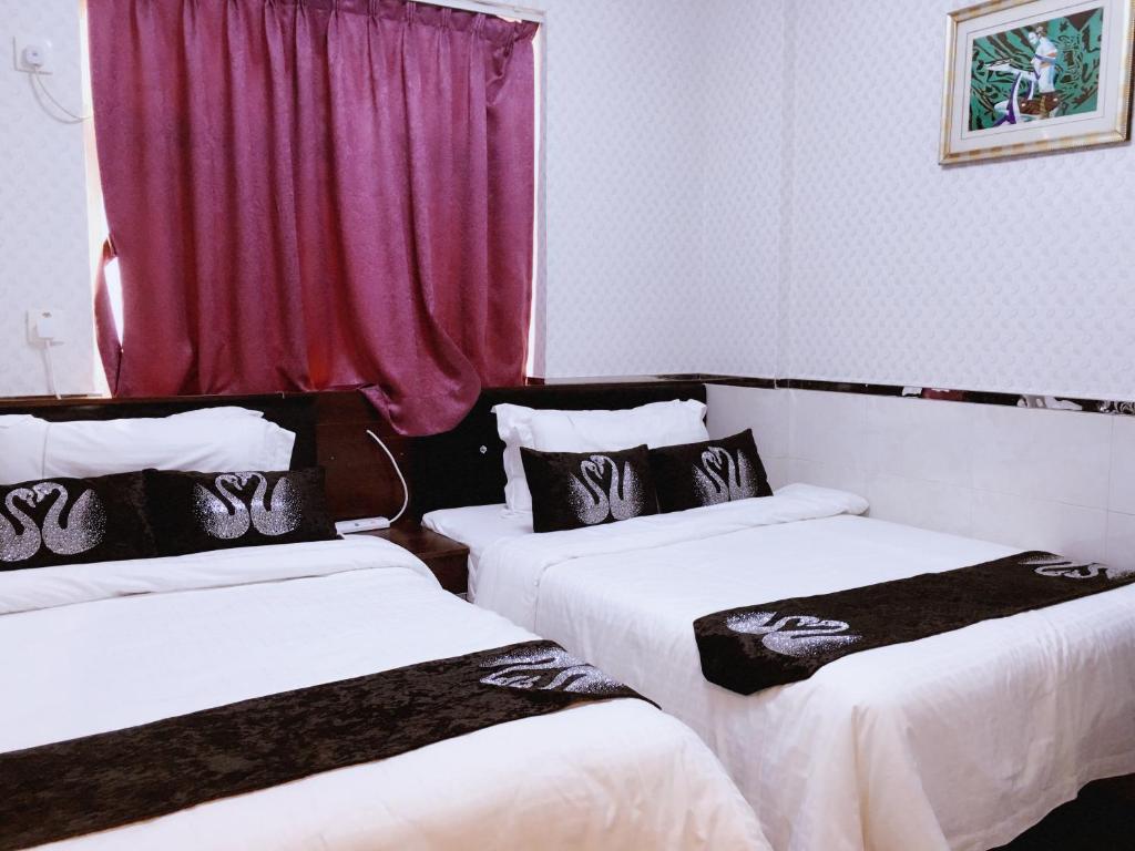 Voodi või voodid majutusasutuse Seasons Hotel - Causeway Bay toas
