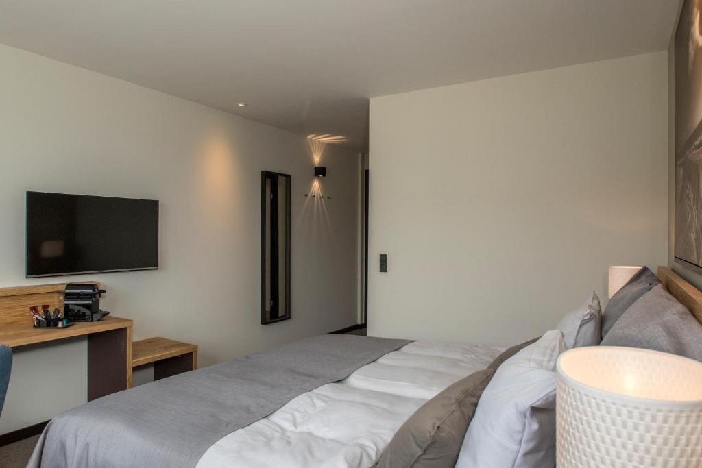 Postel nebo postele na pokoji v ubytování Hotel 6400