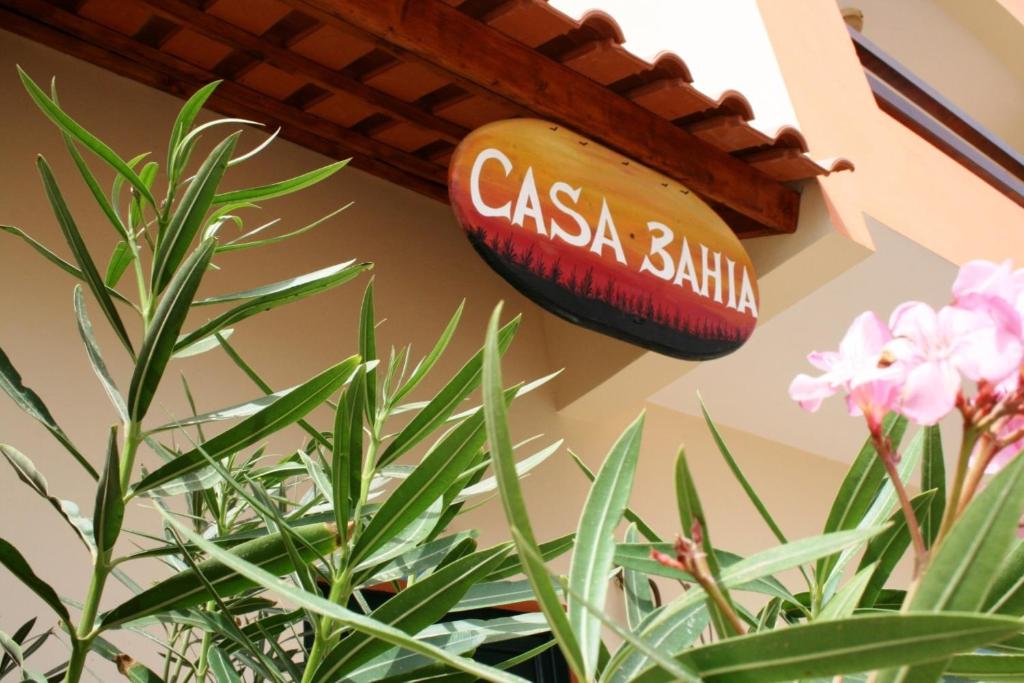 a sign that reads casa balilla hanging on a wall at Casa Bahia 11 in Santa Maria