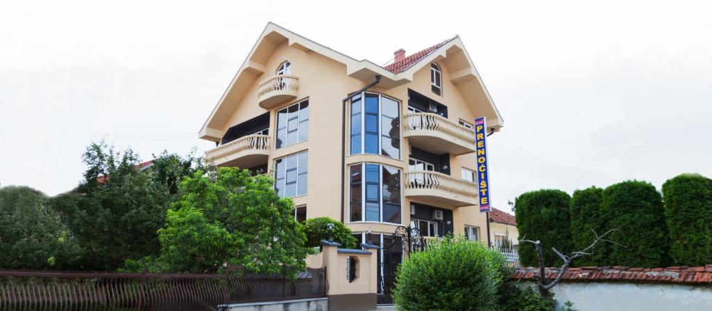 a large building with a lot of windows at Prenoćište Kovač in Vranje