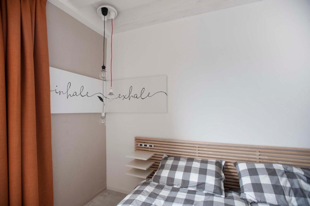 Postel nebo postele na pokoji v ubytování Le Scuderie B&B
