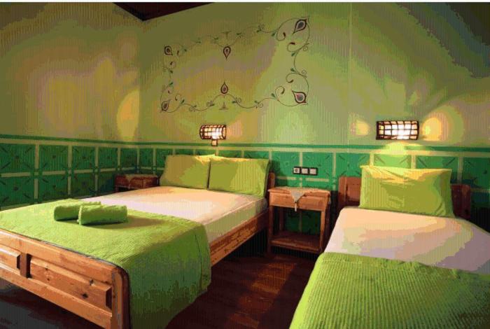 Tempat tidur dalam kamar di Guesthouse Patavalis