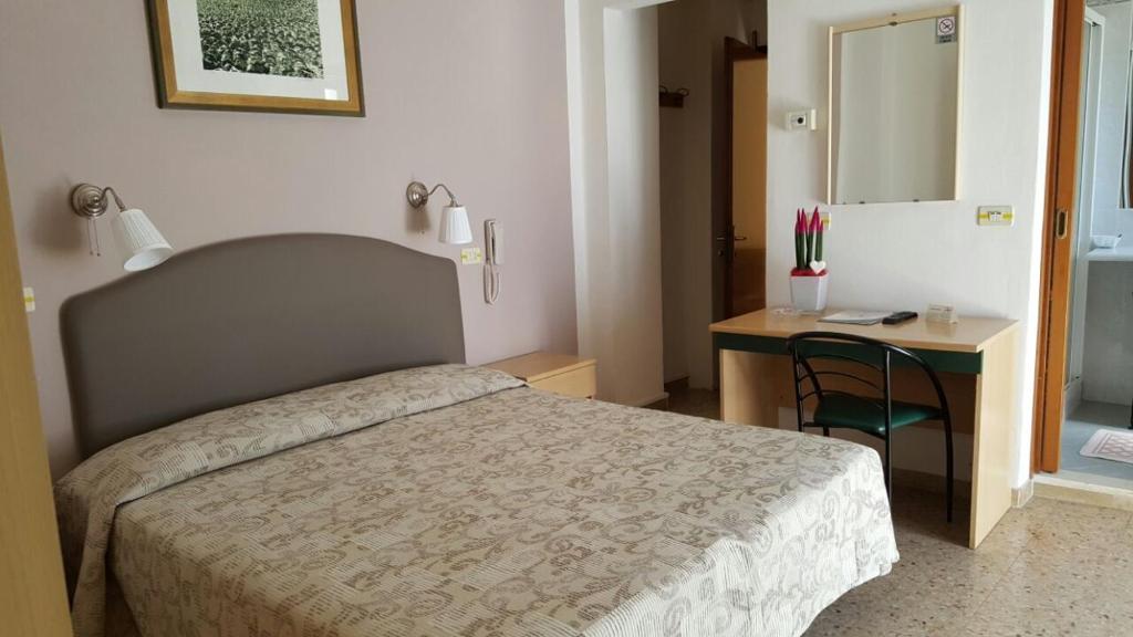 Postel nebo postele na pokoji v ubytování Hotel Marietta