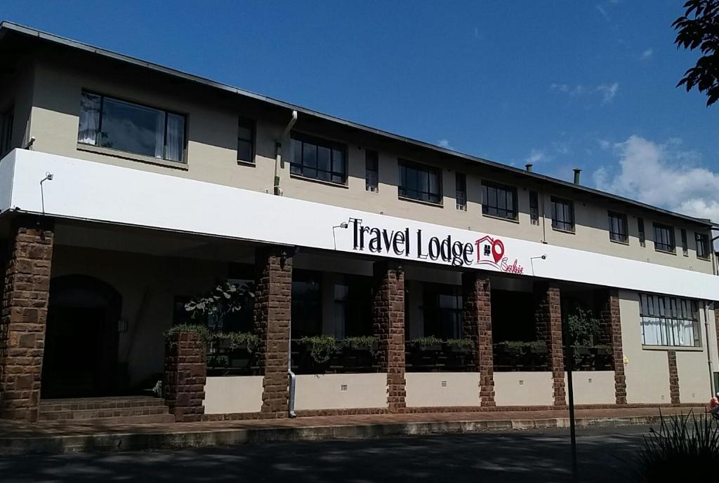 a large building with a travel lodge sign on it at Travel Lodge Sabie in Sabie