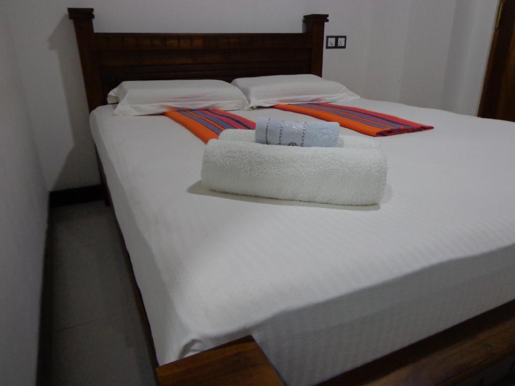 Postel nebo postele na pokoji v ubytování Rajarata Reach Resort