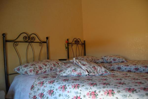 Postel nebo postele na pokoji v ubytování B&B il Castello