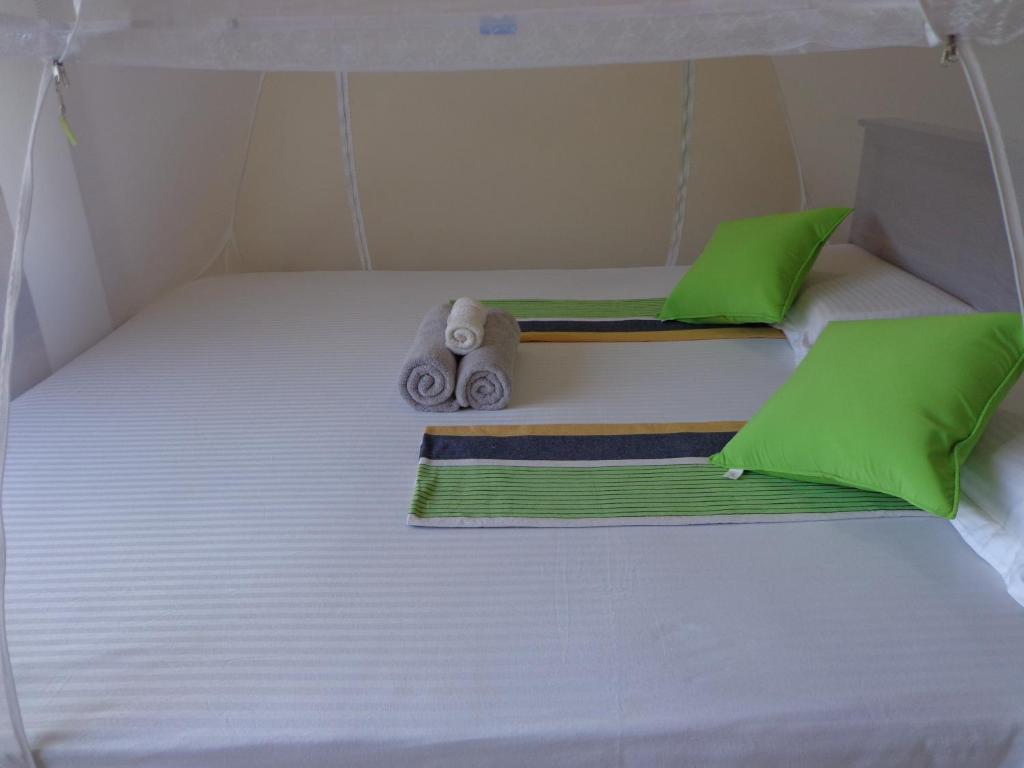 Postel nebo postele na pokoji v ubytování Rajarata Reach Resort