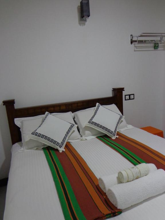 Postel nebo postele na pokoji v ubytování Rajarata Reach Resort