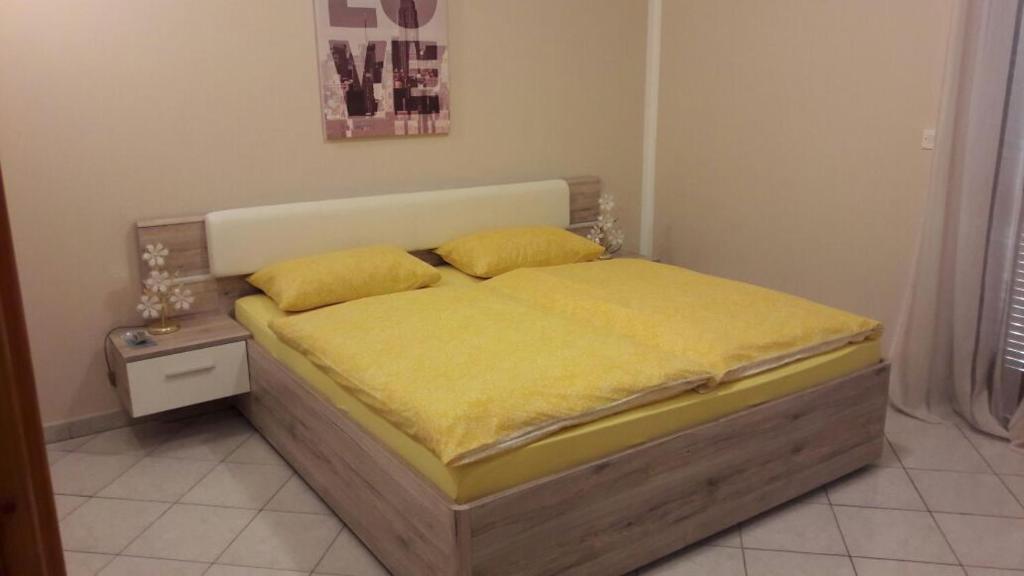 Postel nebo postele na pokoji v ubytování Apartment Smajlovic