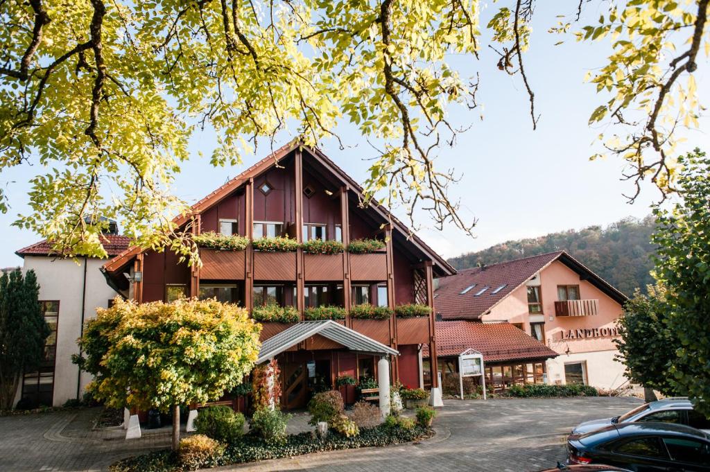 a large building with plants on the side of it at Restaurant & Landhotel Winter in Gomadingen