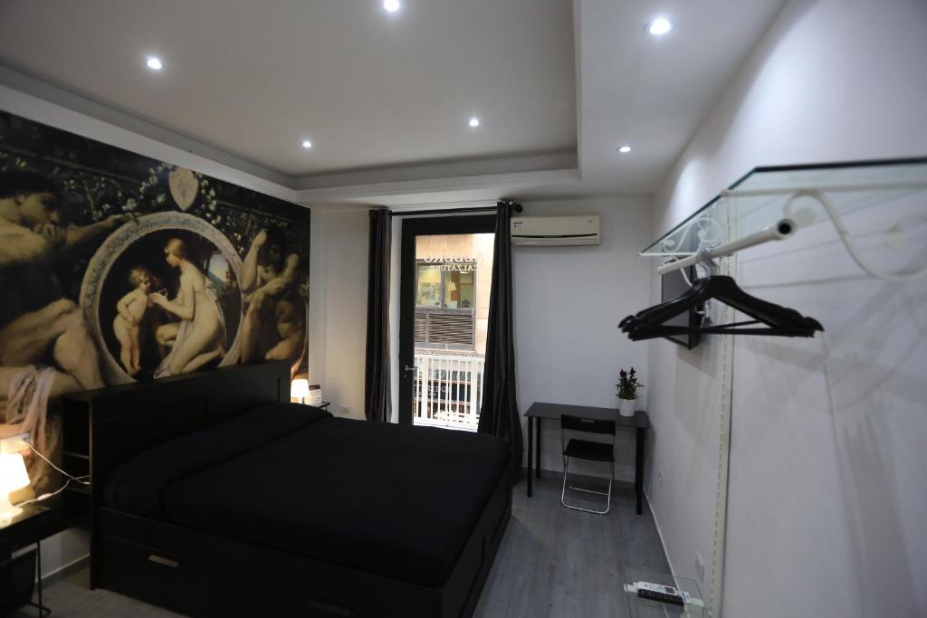 A bed or beds in a room at Cico B&B