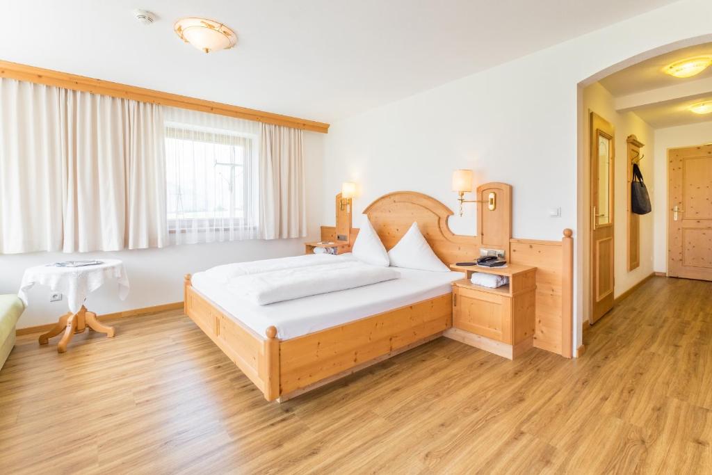 Voodi või voodid majutusasutuse Hotel Riedl im Zillertal toas