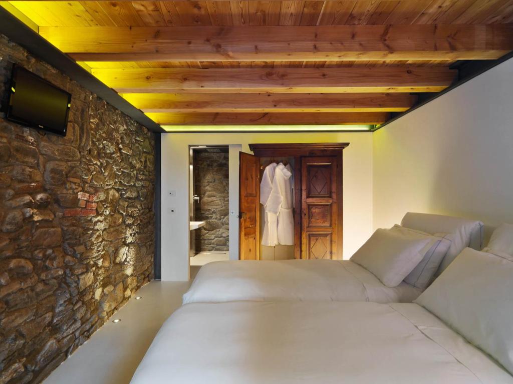 A bed or beds in a room at Le Coffret