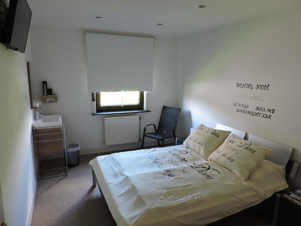 Katil atau katil-katil dalam bilik di B&B Carpe Diem