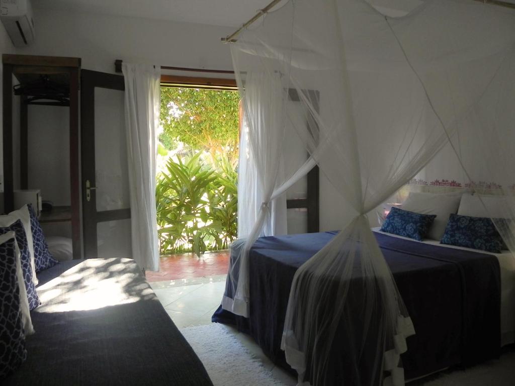 Postel nebo postele na pokoji v ubytování Ouro Sobre Azul Apart Hotel
